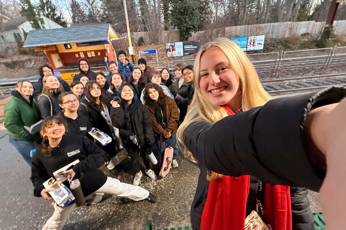 CONVENIENT COMMUTE • Sophomore Kathryn Barrett takes a selfie with members of the yearbook, newspaper, and literary magazine staffs as they prepare to board SEPTA from the Wallingford station for a trip to Temple University on December 6. The one-way cash fare was . 