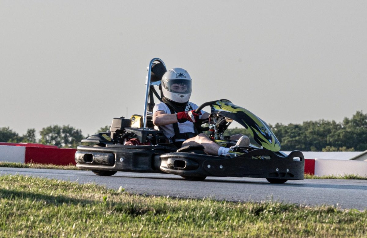 Naperville Central senior Hunter Ernst races around the Kart Circut Autobahn in Joliet on Jul. 17. After having to give up his childhood sport of gymnastics, Ernst found a new home on the racetrack. (Photo courtesy of Hunter Ernst)