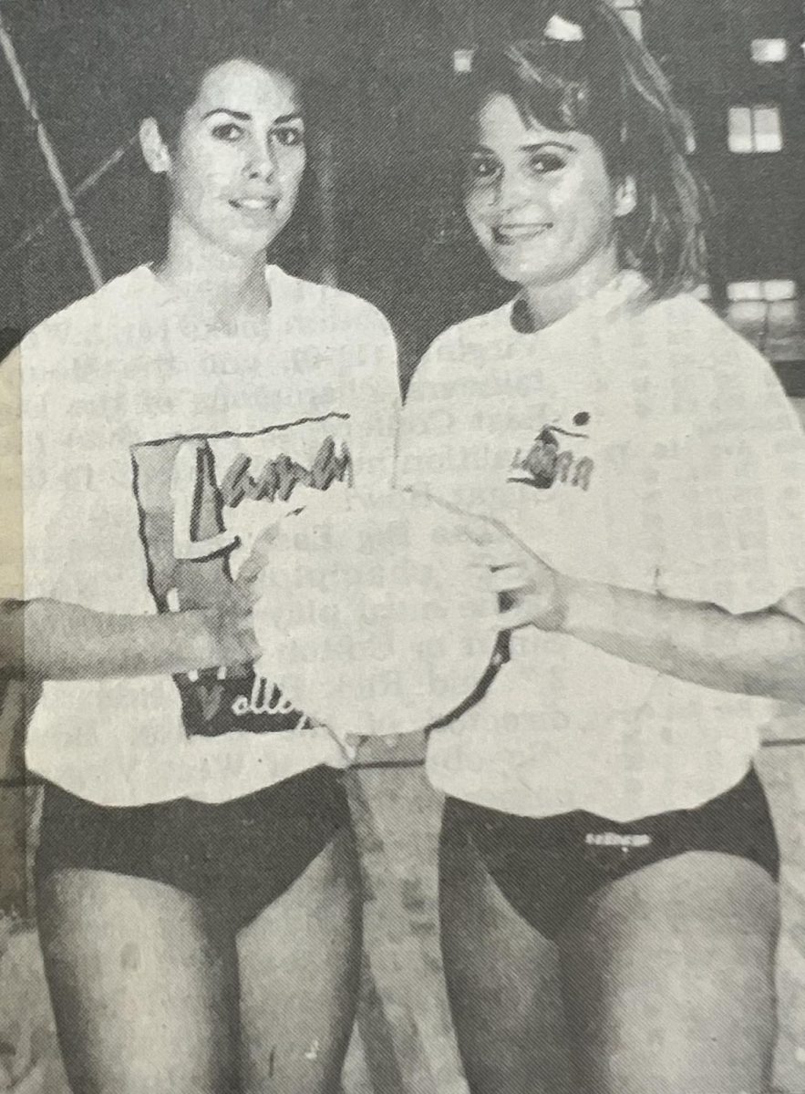 Originally published in The Beaumont Enterprise in the article 'Lady Cardinals hit volleyball glory road', seniors Gene Farris and Melissa Martin prepare for their NCAA first-round match against the University of Arizona. The players hoped to extend their final season through the game but ultimately lost.