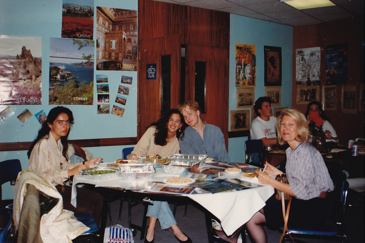 (Middle left) Rita Farhi (’92) sits at the table representing Turkey at the Global Festival in 1992. Being the only Turkish student at the time, Farhi said she was in charge of providing food. 