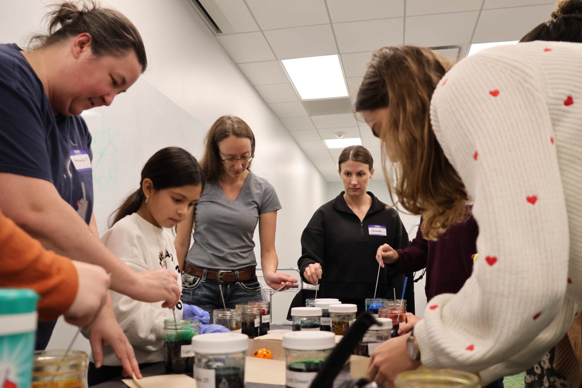 Ukrainian Club members dip their eggs in dye at the Pysanka Easter Egg Making Workshop on Tuesday, Feb. 11, 2025 (Kennedy Long/The Battalion)