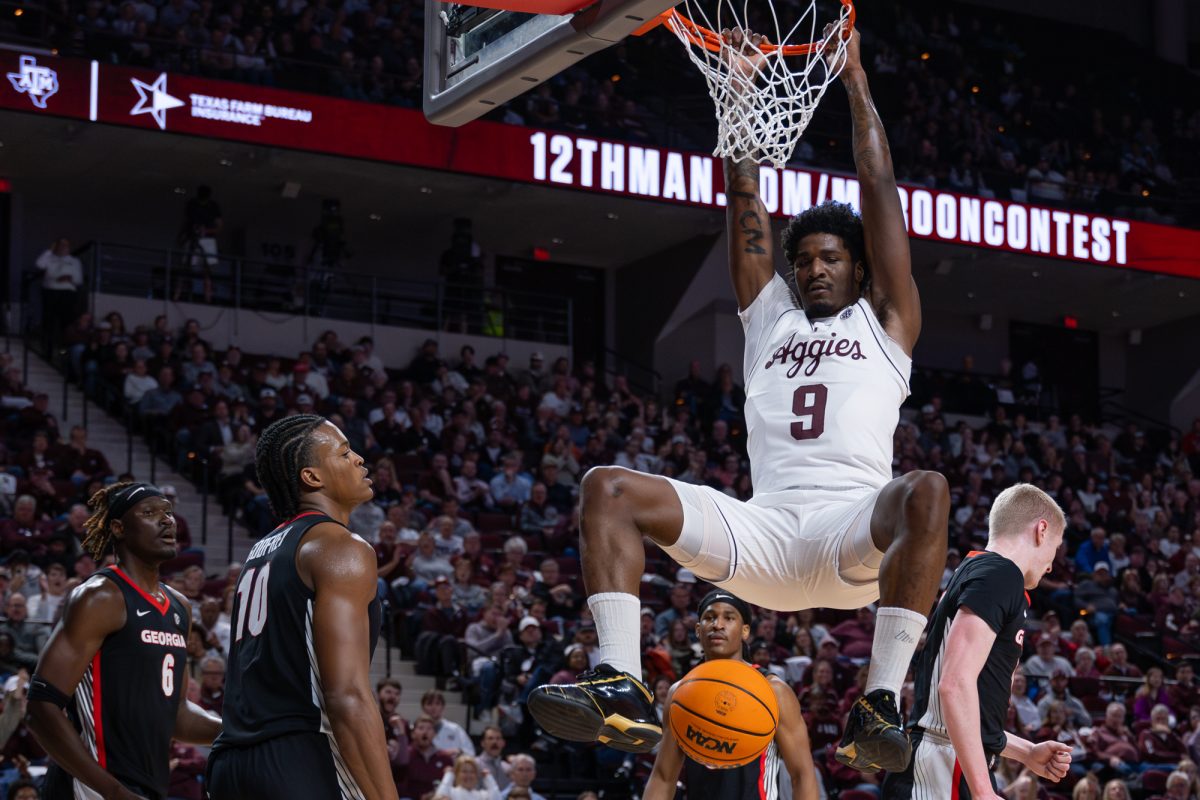 Texas A&M forward Solomon Washington (9) dunks during Texas A&M’s game against Georgia at Reed Arena on Tuesday, Feb. 11, 2025. (Hannah Harrison/The Battalion)