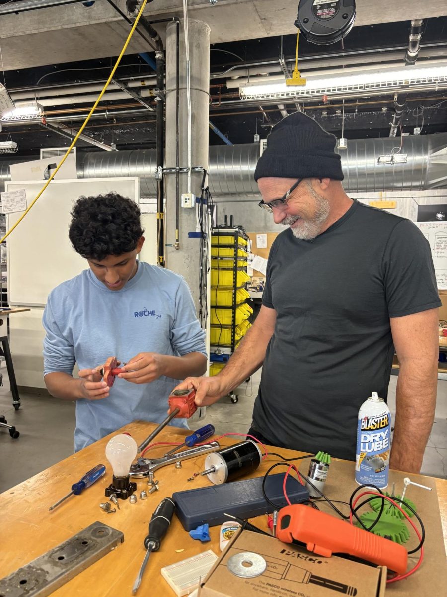 James Dann helps senior Kirin Debnath with his project in the Whitaker Lab.