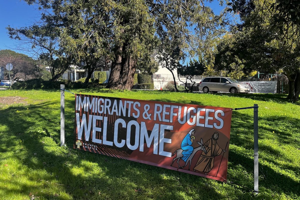 The Congregational Church of the Peninsula (CCP) displays a banner, welcoming immigrants and refugees. 