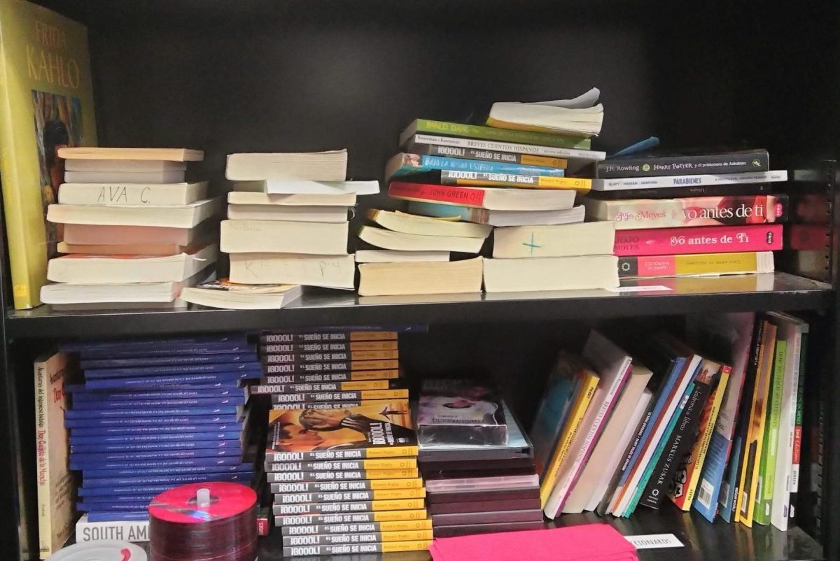 The bookshelf in Viviana Alvarado's classroom is filled with books in Spanish for students to read and check out. Alvarado's collection included popular novels translated from English as well as a new set of books provided by the TPHS Foundation. 