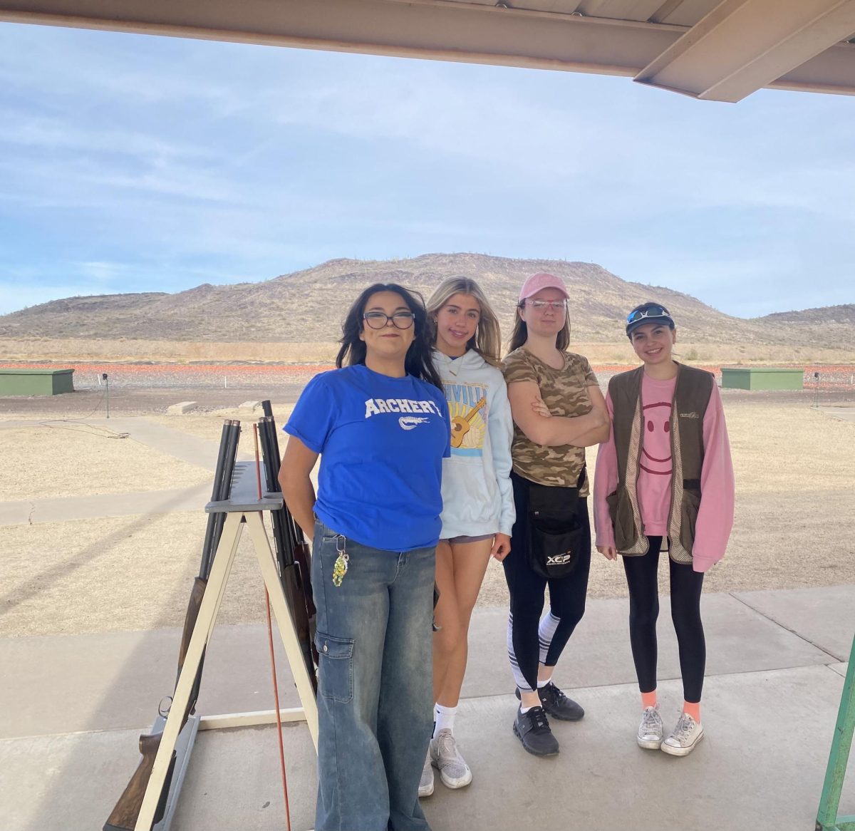 Members of Xavier Hotshots team pose at the Ben Avery Clay Target Center where they practice once a week. Members are divided between stations to practice each of the events. 