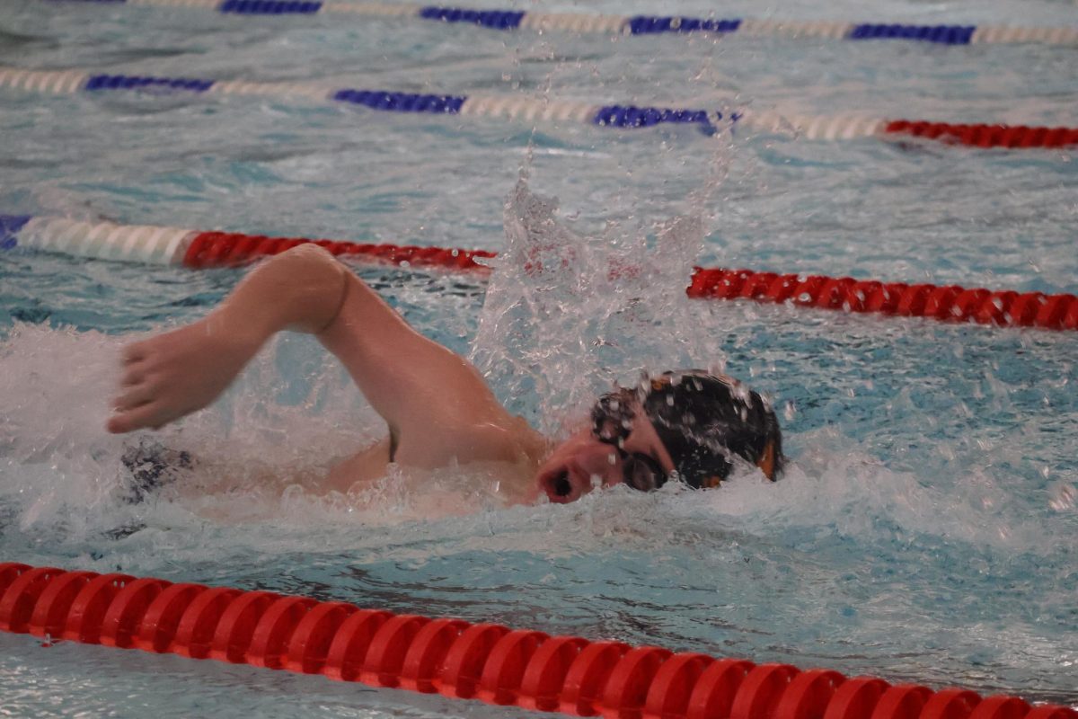 Lukas Doepke (’27) competes in the 50-meter freestyle Feb. 1. Doepke said he hopes to improve his style by the end of the season. “For my technique, I really want to get better at turns,” Doepke said. “I’d also like to get better at my freestyle because it’s, you know, the coolest one.”