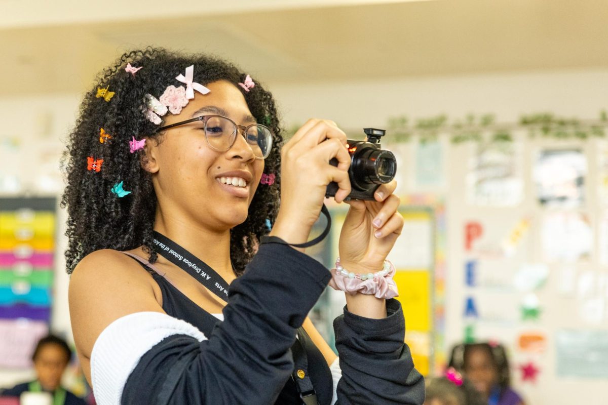 Taking photos of the BSU co-presidents, BSU co-historian and visual senior Stephanie Taffe wears butterfly clips in her hair. BSU members wore their hair in styles reminiscent of hairstyles from their childhood.