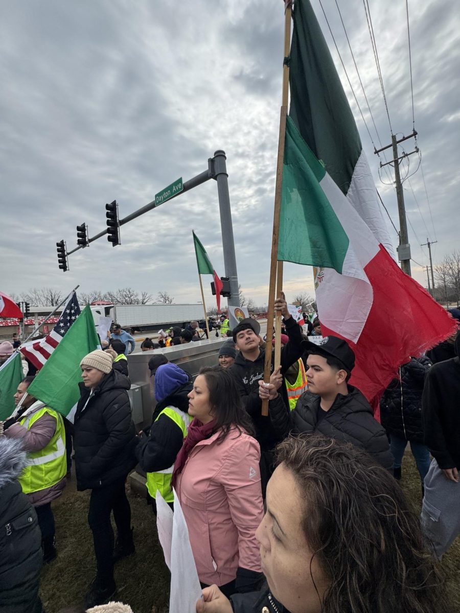 Protesters march through West Chicago on Feb. 3, 2025, carrying Mexican and American flags in solidarity during the "A Day Without Immigrants" demonstration. The march, which began at Thorntons on Neltnor Blvd., was part of a nationwide movement advocating for immigrant rights and protesting potential ICE enforcement.