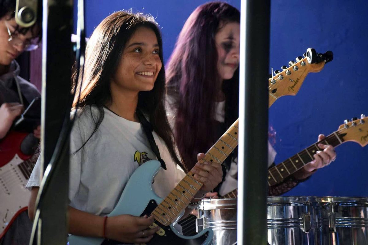 Senior Audrina Senior, a member of the School of Rock, performs live music at The Maverick on January 18, 2025. She has been dedicated to the School of Rock band for the last three years. 