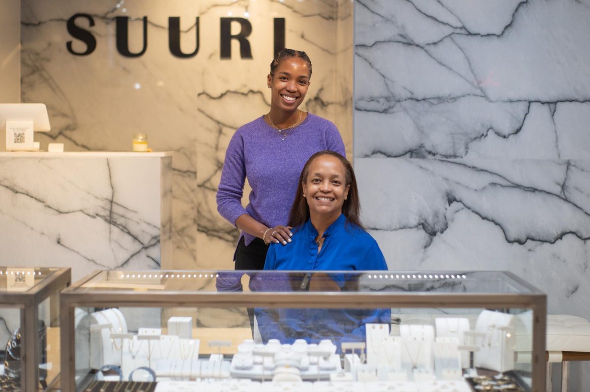 Ashley Cole and mother Linda Cochran pose behind the main counter of their jewelry and bodycare store, Suuri Design. Their handmade creations are intentionally crafted minimalist jewelry that doesn’t break the bank. 