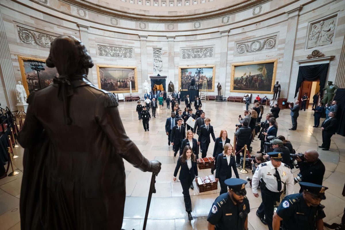 Senate pages carry ballots into the capitol building