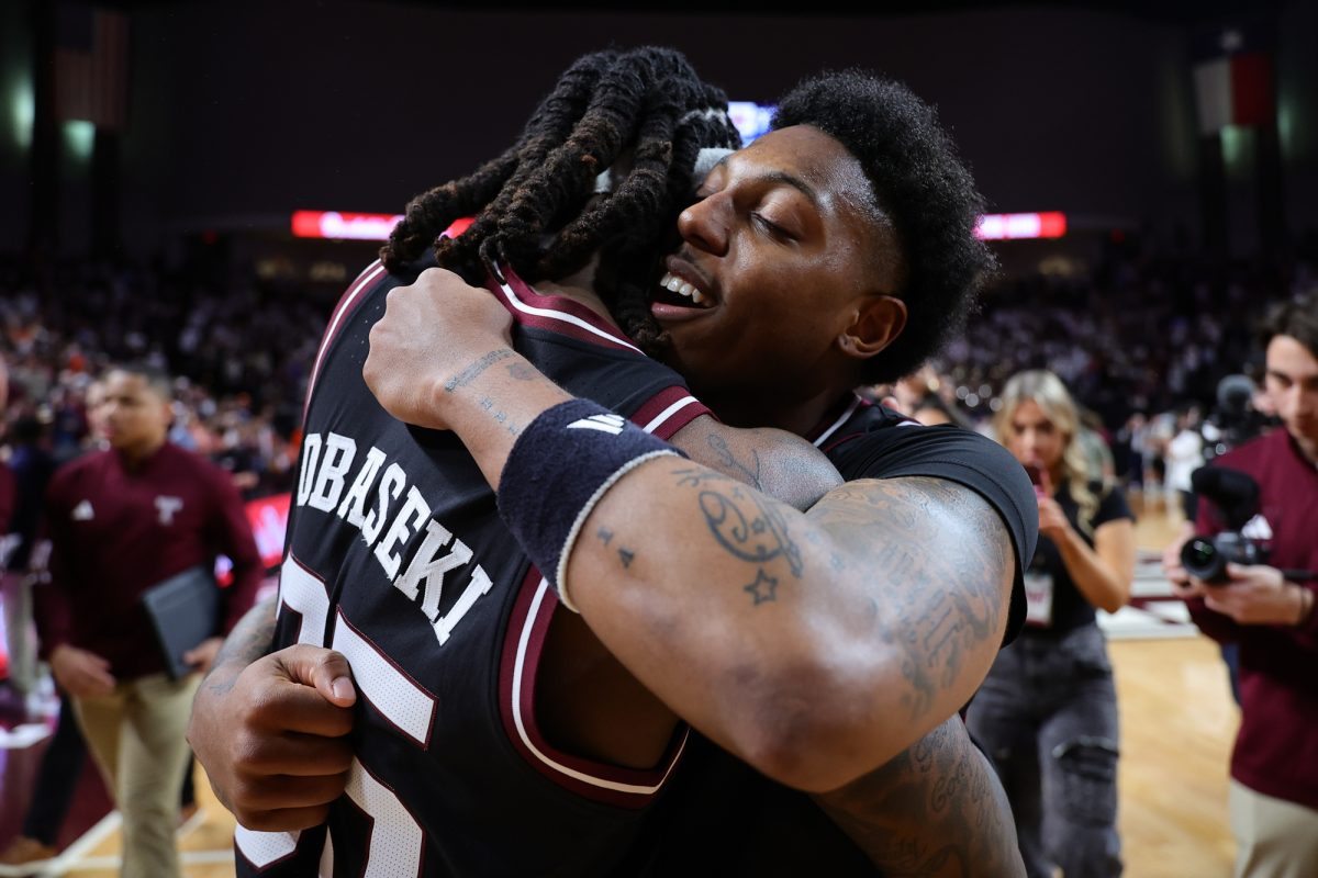 Texas A&amp;M guard Wade Taylor IV (4) hugs guard Manny Obaseki (35) after Texas A&amp;M’s upset win against Auburn at Reed Arena on Tuesday, March 4, 2025. (Chris Swann/The Battalion)