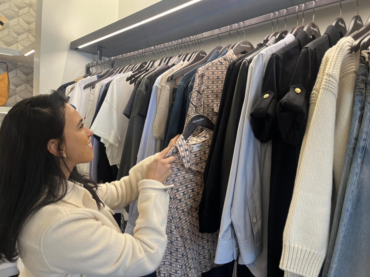 Stylist Flor Hernandez stocks clothing at Elyse Walker's Calabasas Commons Location. Elyse Walker was founded in 1999, and currently has three locations around the Los Angeles area. They lost two locations due to the Palisades fire, but are hoping to rebuild. 