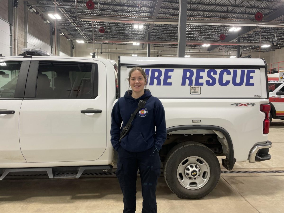 Halli Leonhardt (12) stands by a fire rescue truck before training. Leonhardt started her journey as a firefighter in June of last year. “I always just kind of wanted to help,” Leonhardt said.