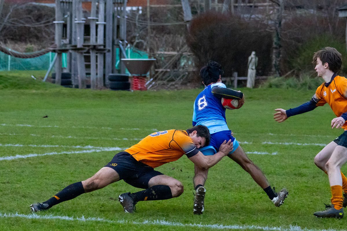 Can Ugur (’27) lunges to tackle a TASIS player as Arthur Lamond (’26) runs to help. Coach Ryan Erickson said the team will refer to their game against TASIS to see how they can improve in the future. “Monday, we’ll kind of review the game tape that we have, find some highlights of things we did well, applaud those and then look at things that we need to continue to work on and think about how we need to get better at,” Erickson said. 