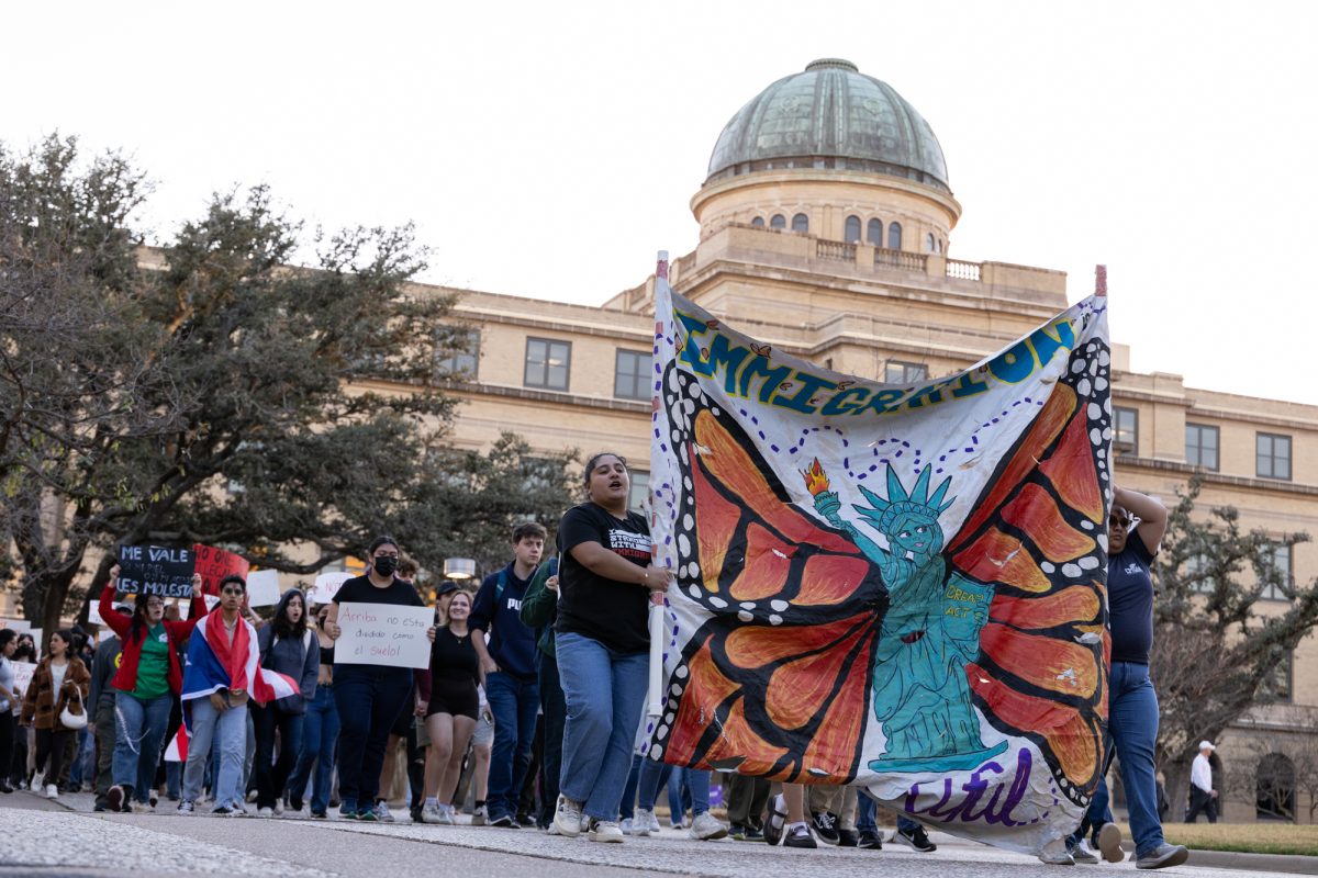 Aggies march and carry an "immigration is beautiful" sign during the "Protest for Immigrants" at the Academic Building on Wednesday, March 5, 2025. (Adriano Espinosa/The Battalion)