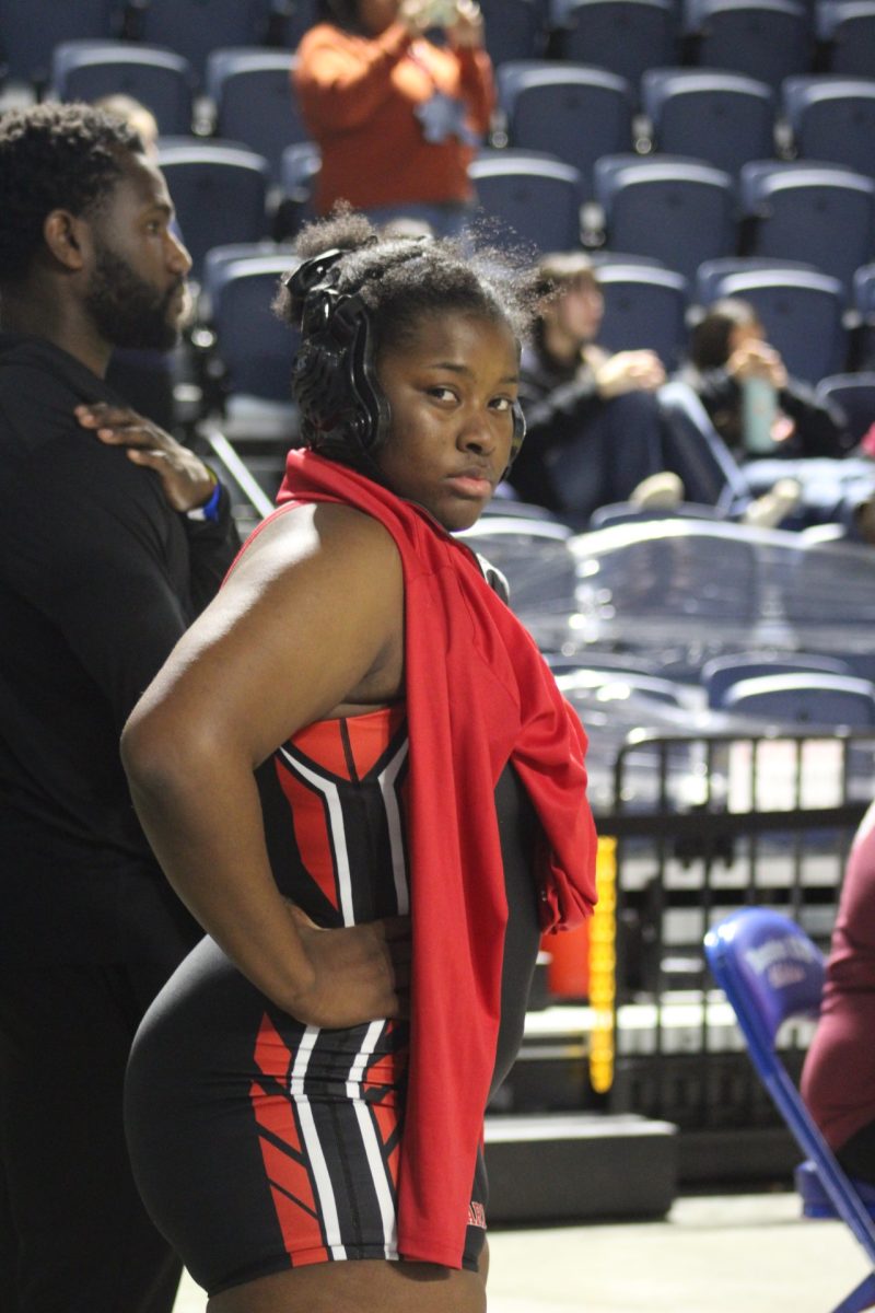 Junior Kate Oguntoyinbo stands during a break at districts. Oguntoyinbo finished in fourth place in the 18-6A district, allowing her to move on to regionals.