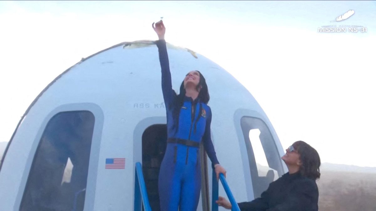 Pop star Katy Perry comes out of the capsule in which she, journalists Gayle King, Lauren Sanchez, who is also billionaire Jeff Bezos' fiance and other participants, landed back on earth after blasting off into space on a Blue Origin rocket, as part of the New Shepard Mission NS-31, marking the first all-female flight crew in more than six decades, in West Texas, Texas, U.S., April 14, 2025, in this screen grab taken from a video. Blue Origin/Handout via REUTERS