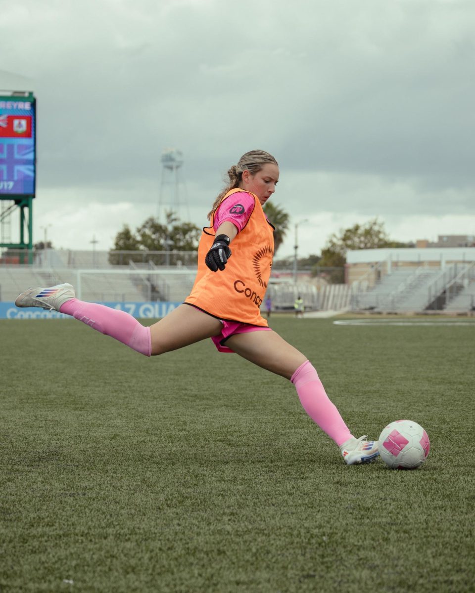 Moore kicking long balls to another goalkeeper while warming up for a game in Puerto Rico. 
Photo by Victoria Moore, used with permission.