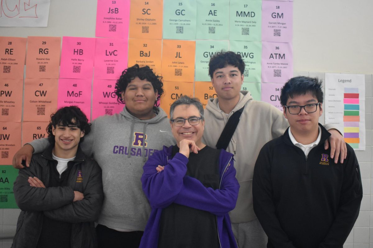 Former teacher Michael McGarry poses with students before his retirement in 2023 due to his battle with ALS.