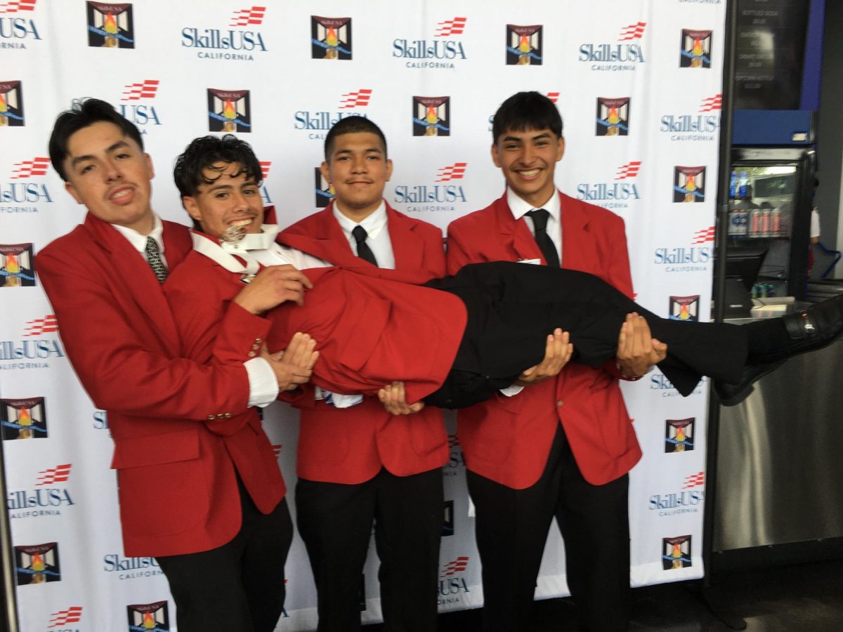 The SkillsUSA team laughs it up as they celebrate teammate Ghael Pasos taking the silver medal in welding sculpture. From left: Andrew Luquin, Joel Benitez, Abel Perez and Ghael Pasos. 