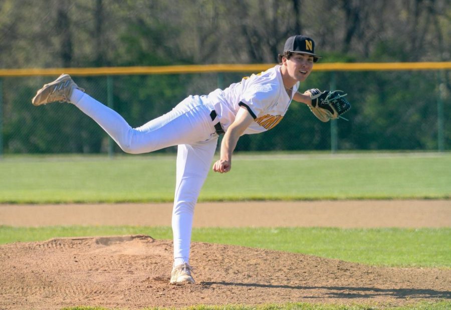 Senior Carter Stover pitches ball during a game against Liberty April 8 at home.