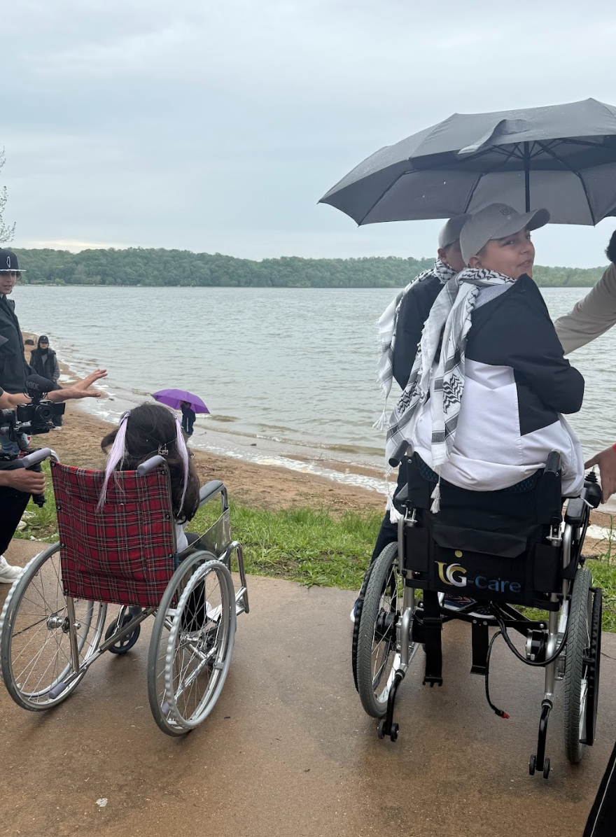 Tala (left) and Mustafa (right) gaze upon Creve Couer Lake. Both children are amputees from Gaza seeking medical care in St. Louis.