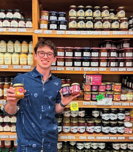 Joshua Friedlander pictured with his jams in Miles Farmers Market. Photo taken by Lisa Friedlander and provided by Joshua Friedlander.