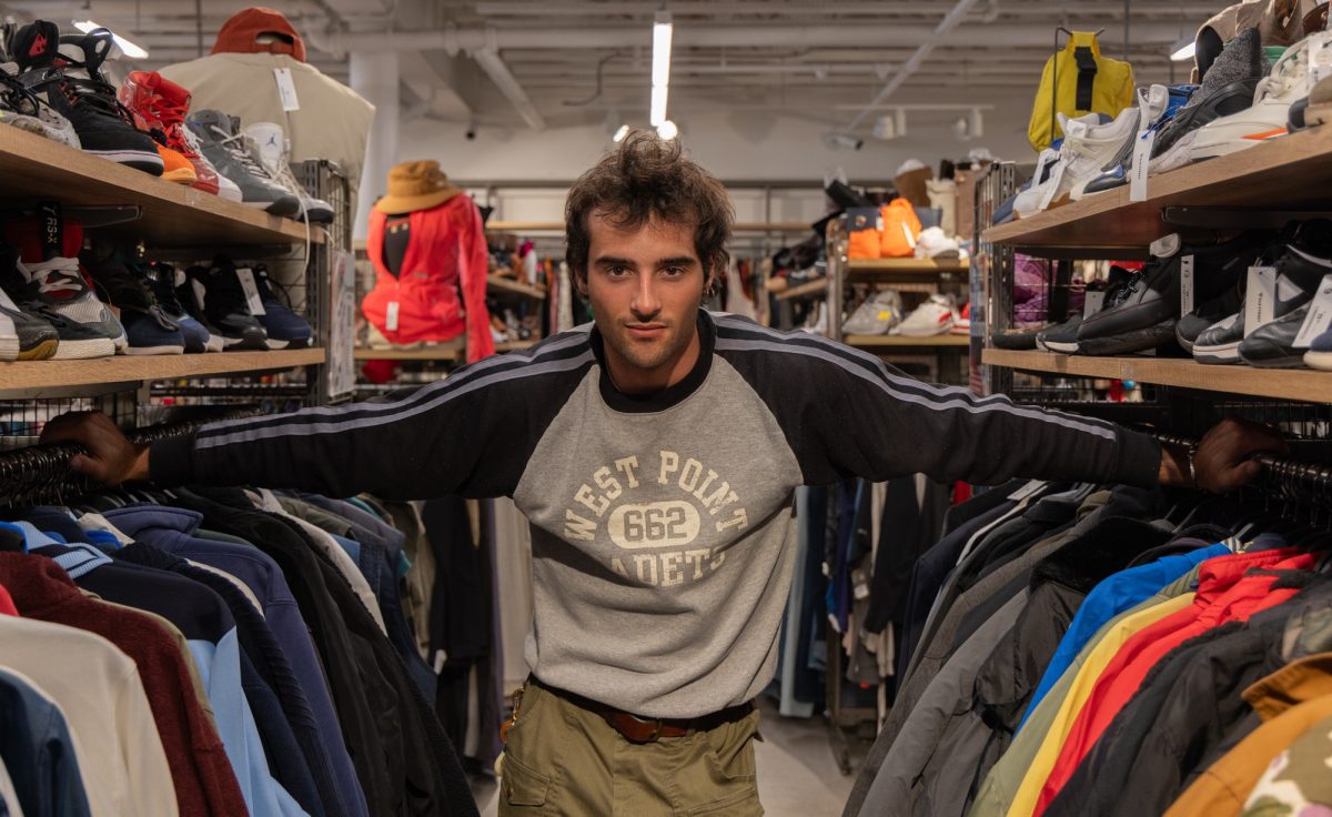 Maximillian Ryan, 21, stands between aisles at 2nd STREET in Torrance on April 9. Ryan is a content creator with 28,000 followers on Instagram. (Angel Pasillas | Warrior Life )
