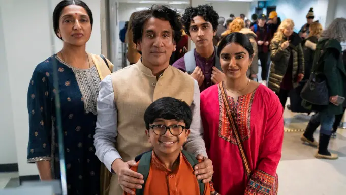 “The Pradeeps of Pittsburgh,” and the clothing that makes them look like they came straight from a haldi ceremony. (Source: Prime Video)