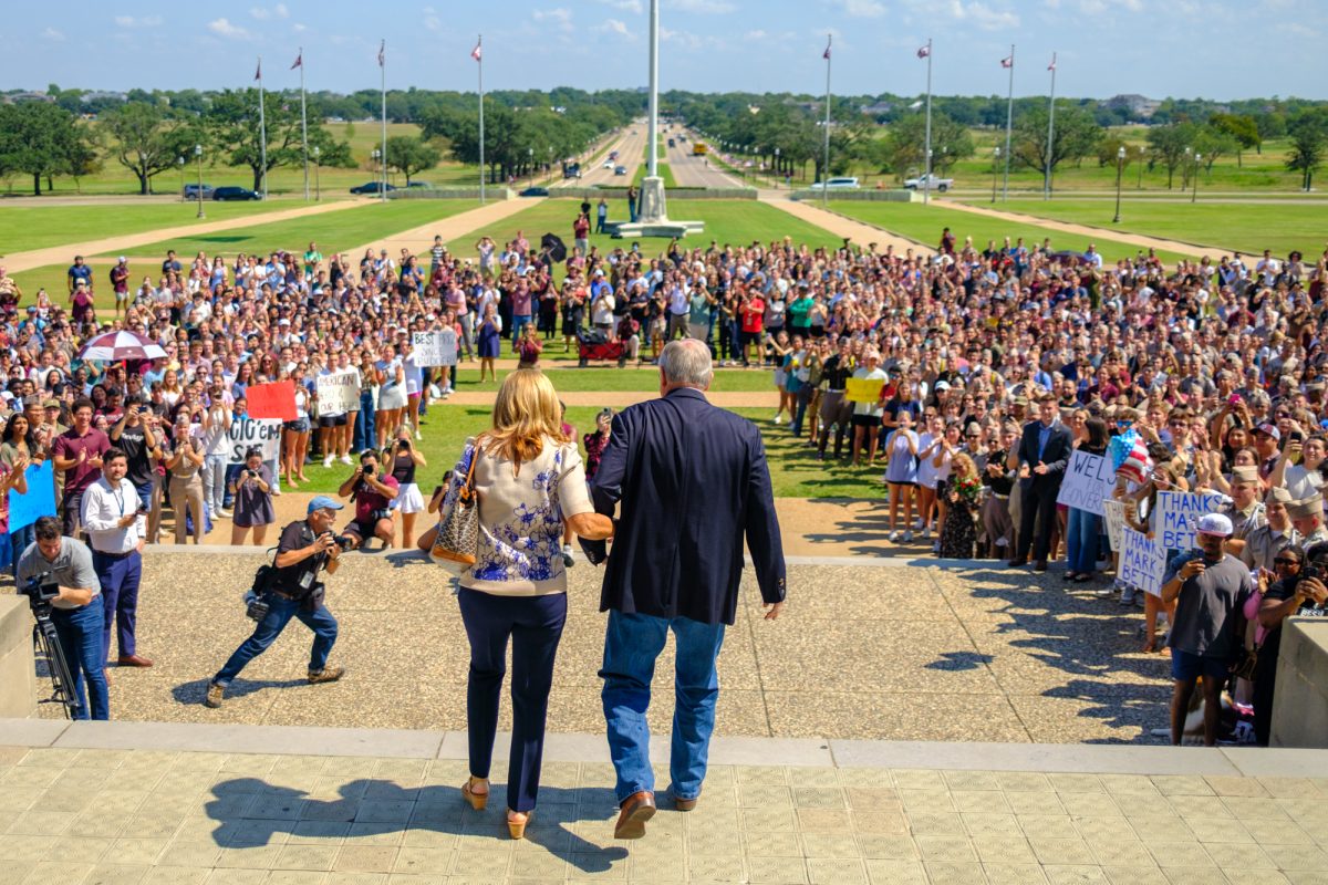 Texas A&M President Mark A. Welsh III and wife Betty exit to clapping and cheering at the Administration Building on Friday, Sept. 19, 2025. (Alex Garza/The Battalion)