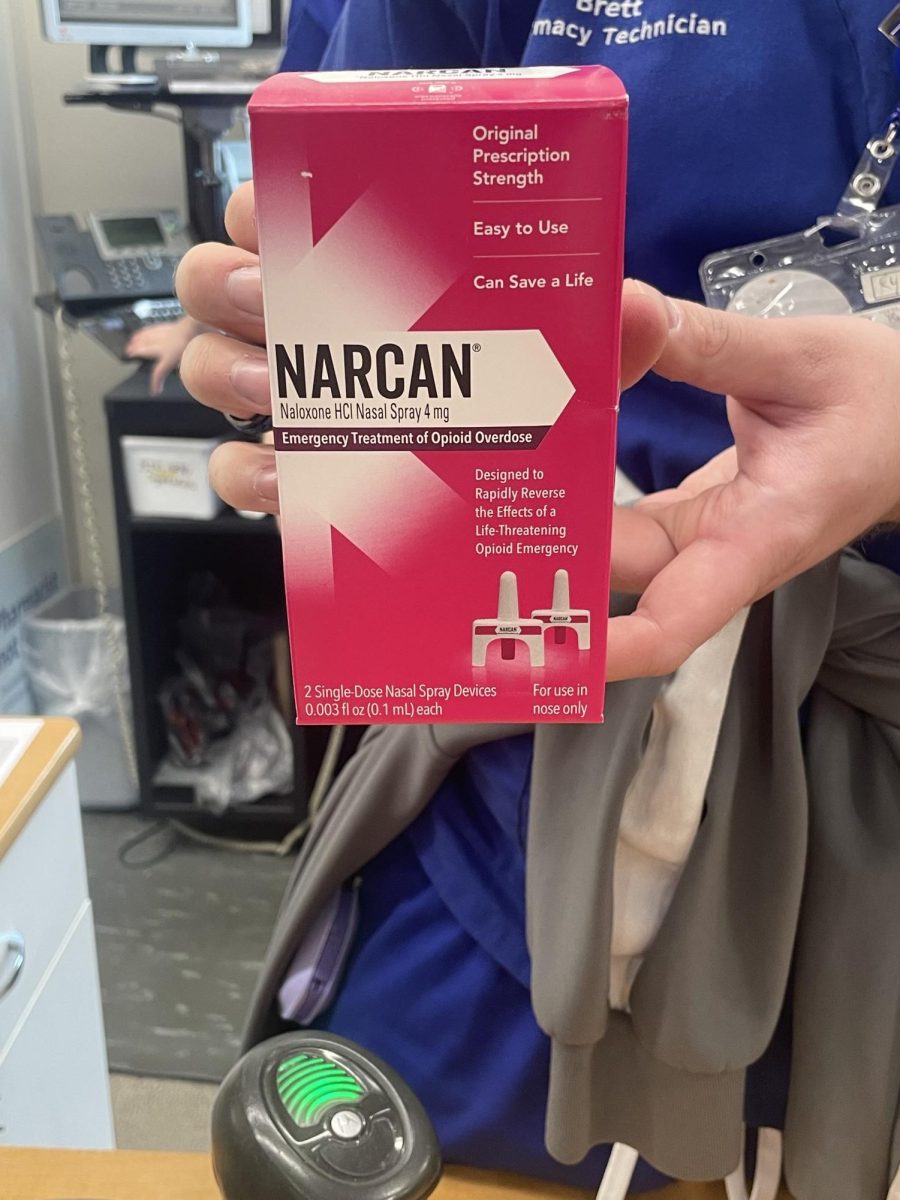 A pharmacist displaying Narcan availability at the CVS Pharmacy at 5644 Mayfield Rd.