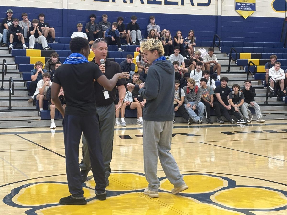 Senior Chuck Aluka and sophomore Grady Fransen face off in the finals of Del Val's rock-paper-scissors tournament. Both students participated in games all morning long before competing against 10 other finalists for a chance at two free Homecoming tickets.