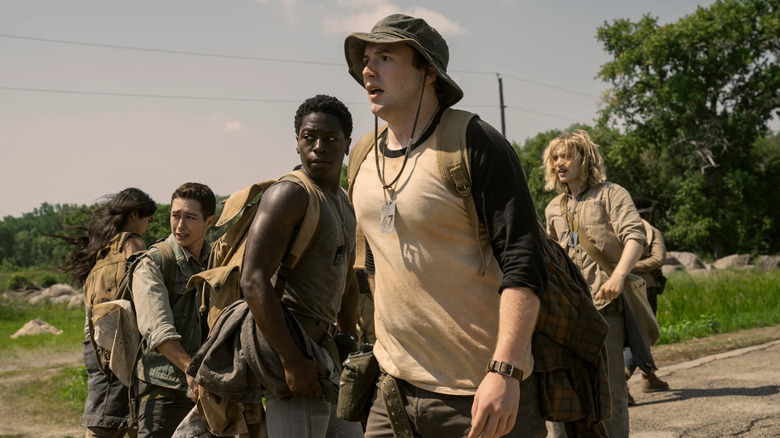 The participants of the Long Walk, a dystopian tournament, walk backwards to watch the violence unfold. Photo courtesy of Lionsgate