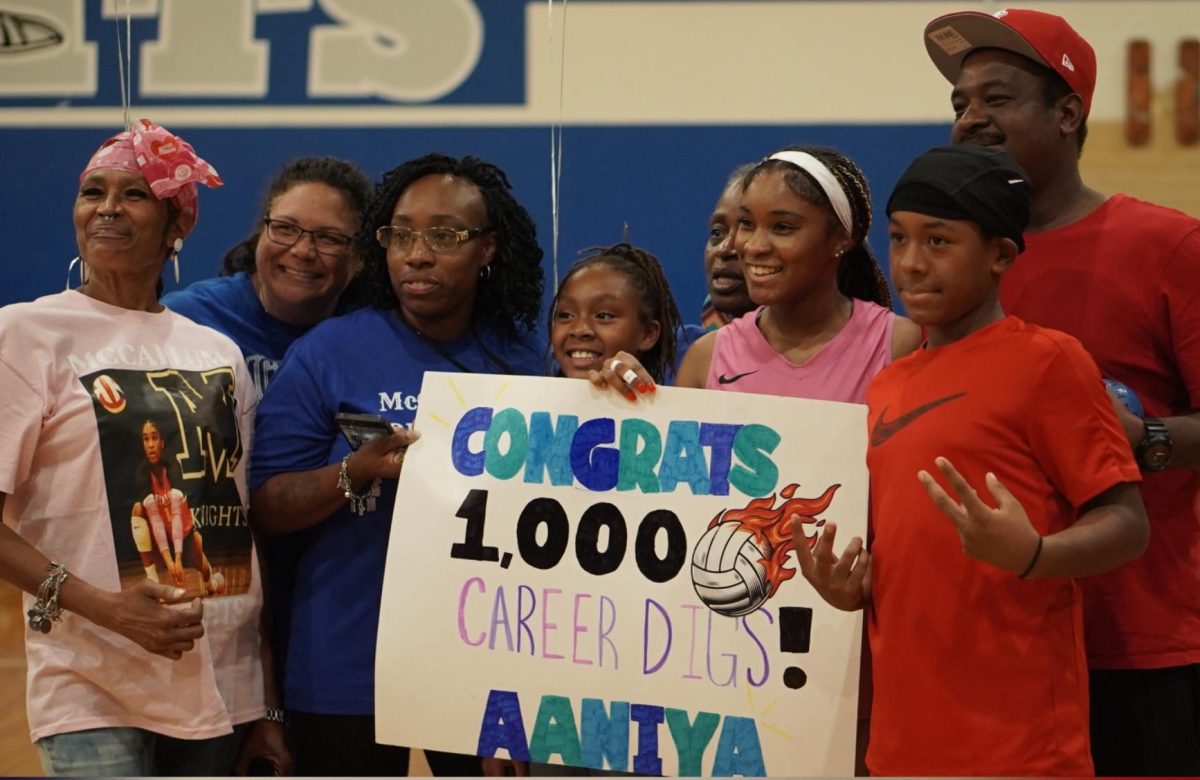 Senior Aaniya Thornton celebrates 1,000 digs with her family after the varsity volleyball game against the LASA Raptors on Friday, Sept. 12.
