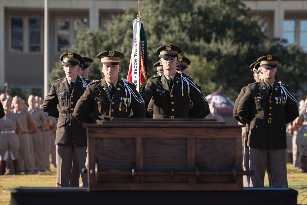 Corps of Cadets Company E-2 stands at attention during the Reveille IX funeral service at Simpson Drill Field on Friday, Oct. 10, 2025. (David Moran/The Battalion)