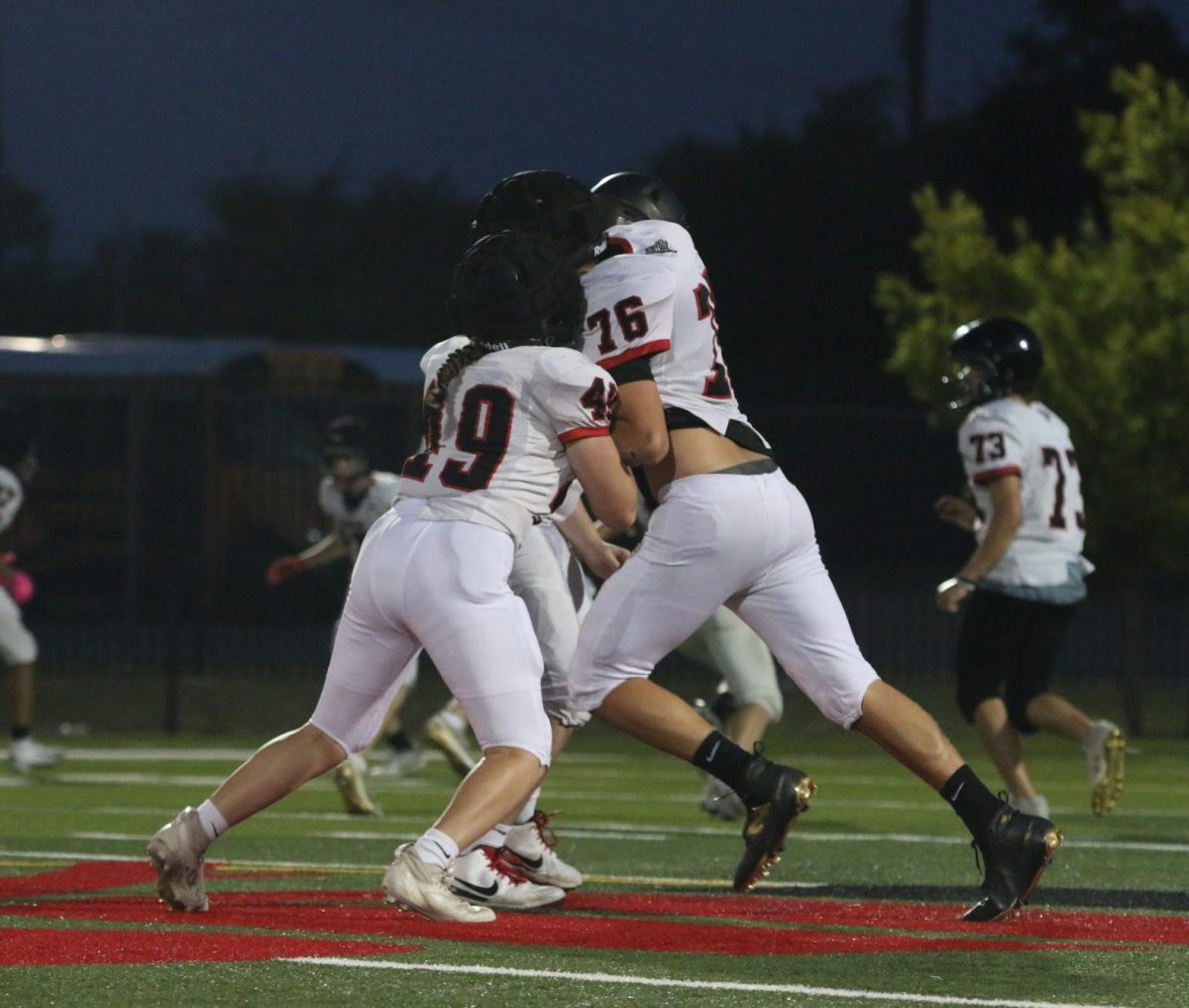 STANDING STRONG: Maddie Kerrigan (#49) goes all in, meeting her opponent in a head to head tackle. Determined she continues pushing with purpose, the ultimate goal being to knock the opposing player over.