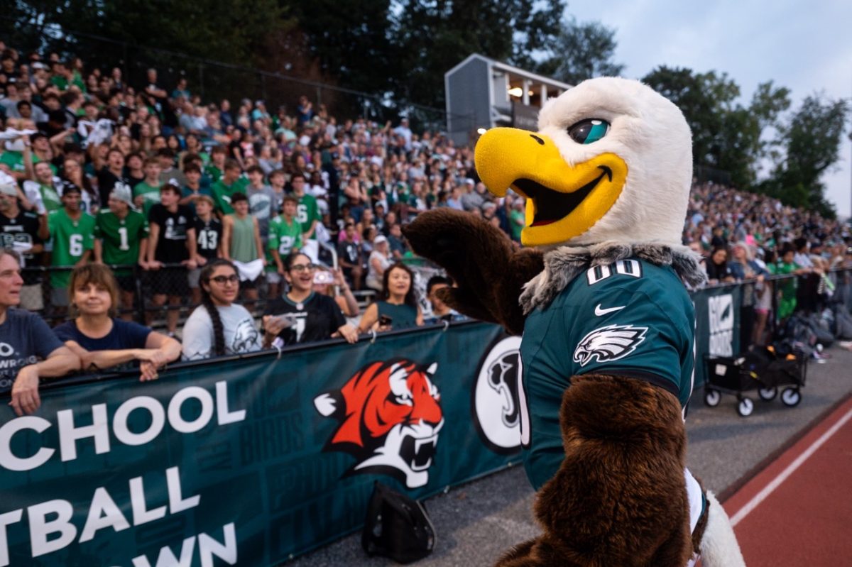 Eagles mascot Swoop leads the student section through an Eagles chant during the Eagles High School Football Showdown on Friday, September 26. The showdown was a way for the Eagles to interact with Eagles fans with player appearances from former players, drumline, cheerleaders, and various photo ops.