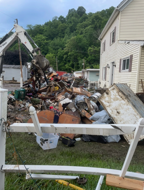 Rubble and trash being collected due to the floods 
Photo courtesy of Mrs. Freeman