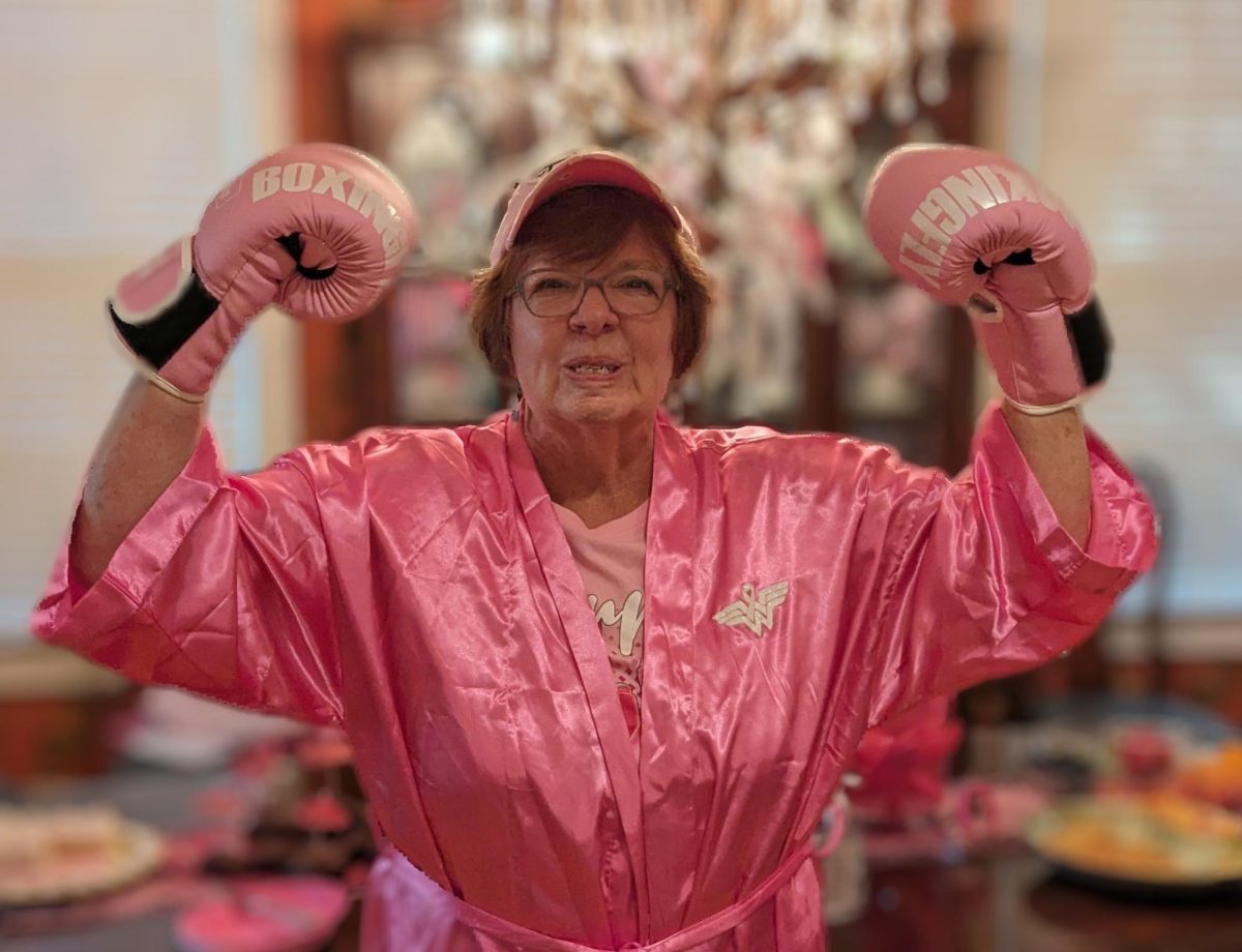 Nana shows off her strength during a family celebration of Breast Cancer Awareness Month.