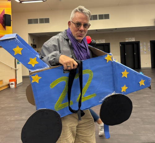 Mr. Nemecek rolls into retirement with a smile, taking one final joyride in his cardboard car on his last day at Day Creek.