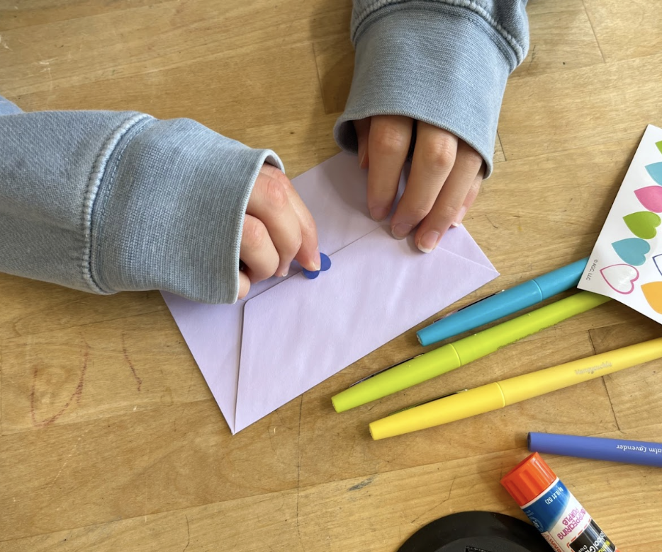 Closing off a letter for a Hospital Campaign, where the notes will be sent off to patients recovering from an eating disorder. Photo courtesy of Sarah Xu. 