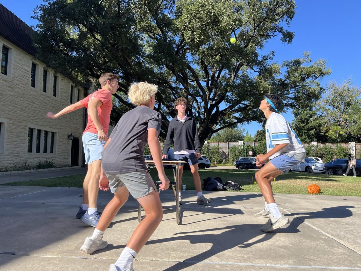 Sophomores Hudson Peakes, George Hricik, Nathaniel Dow and Calder Major engage in a competitive game of Spike Tennis. 