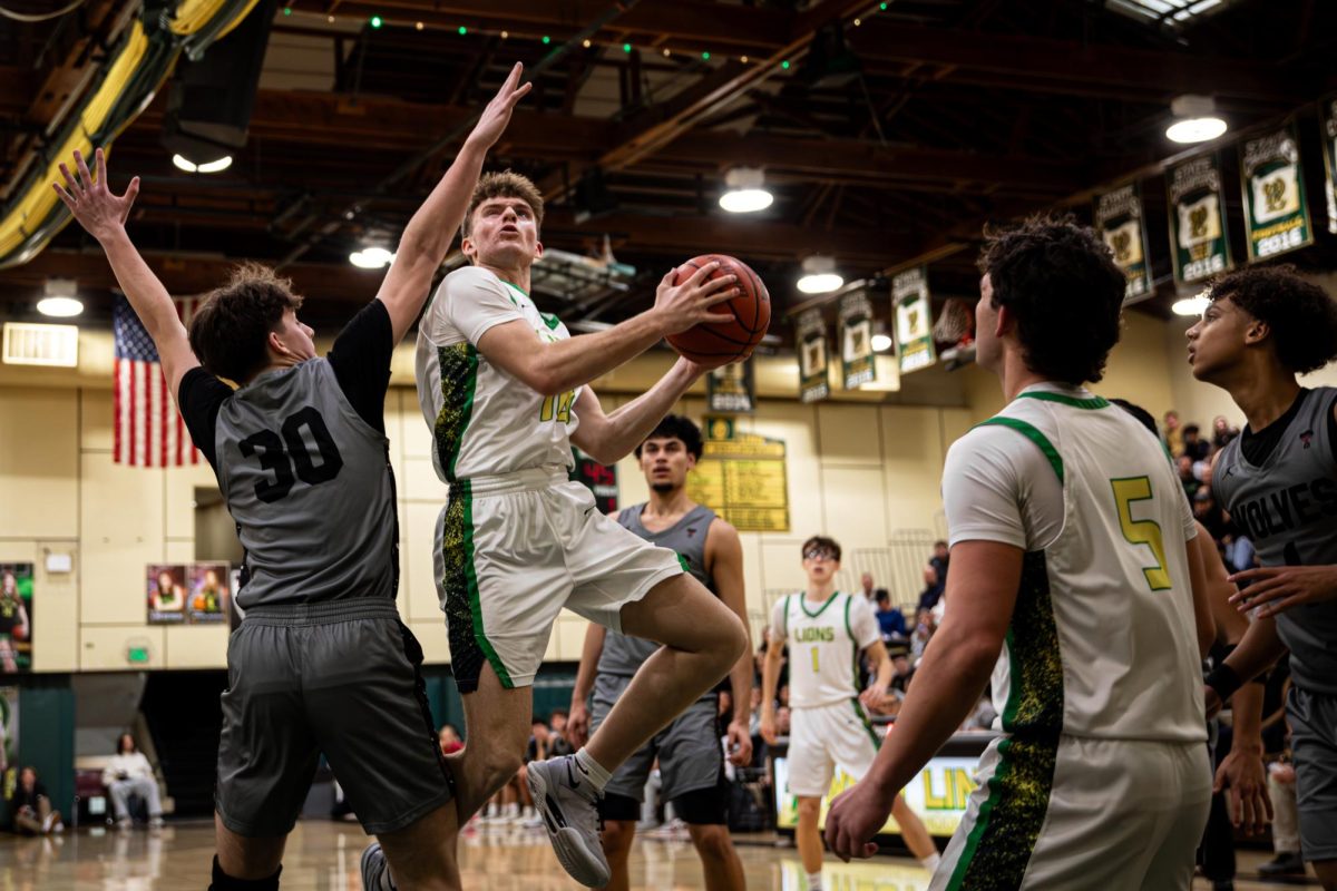 Carson Smiley, junior, shoots a contested layup as the Lions rally in the third quarter. 