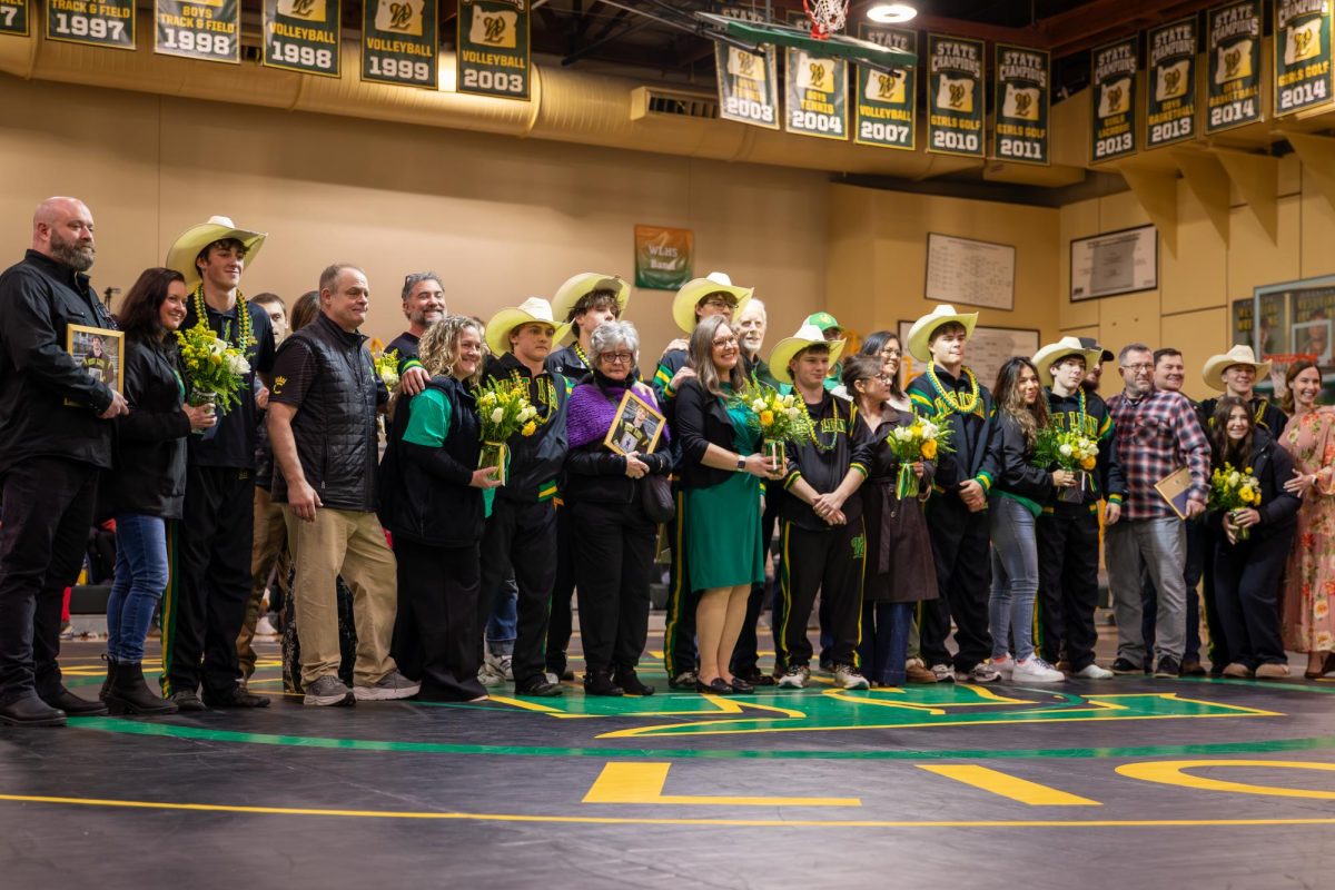 As the seniors line up with their families, they wear cowboy hats to commemorate the life of Lucas Gray, a West Linn class of 2025 alumnus and wrestler who passed away in 2025.