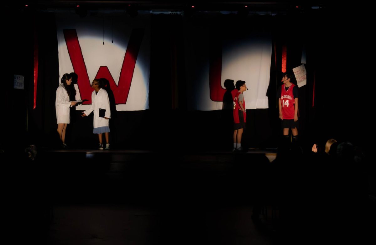 The spotlight crew lights up the stage during a scene in Day Creek Intermediate's production of High School Musical Jr.
