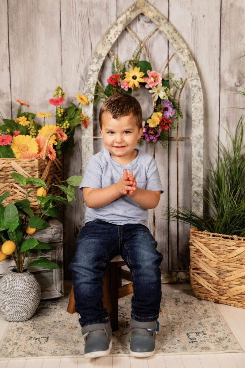 Ryder posing for a photo with a professional background, provided by Maggie Buckley.