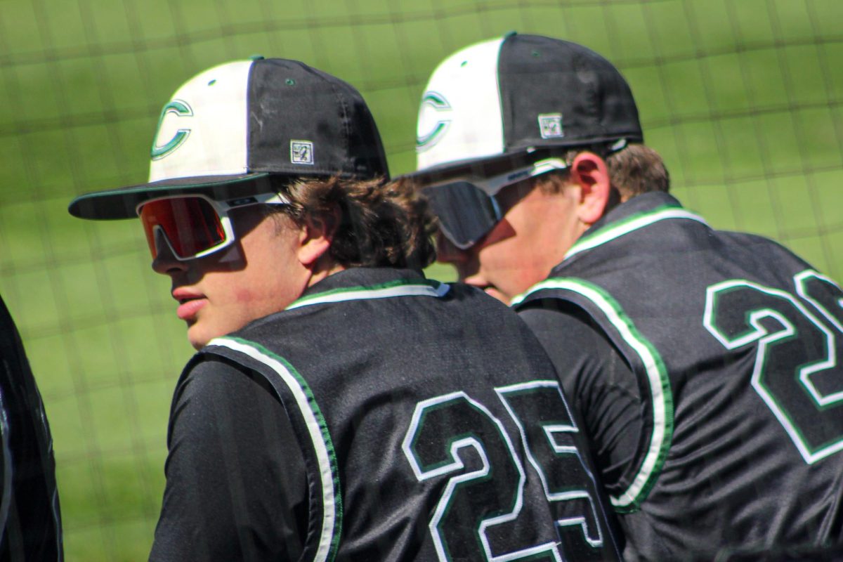 Senior Declan Kowbuz sophomore McKade Tracy stand in the east dugout during their game against Northfield High School at Coors Field on April 15.