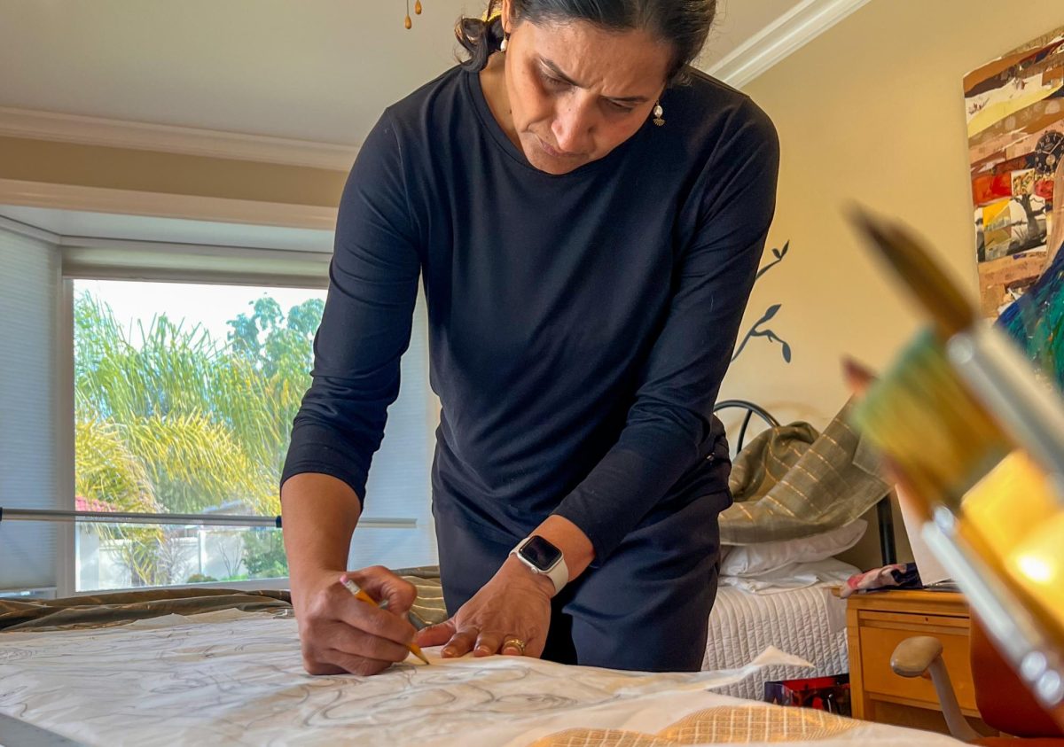 Sheetal Seth works on her saree artwork in her studio. (Courtesy of Sheetal Seth)